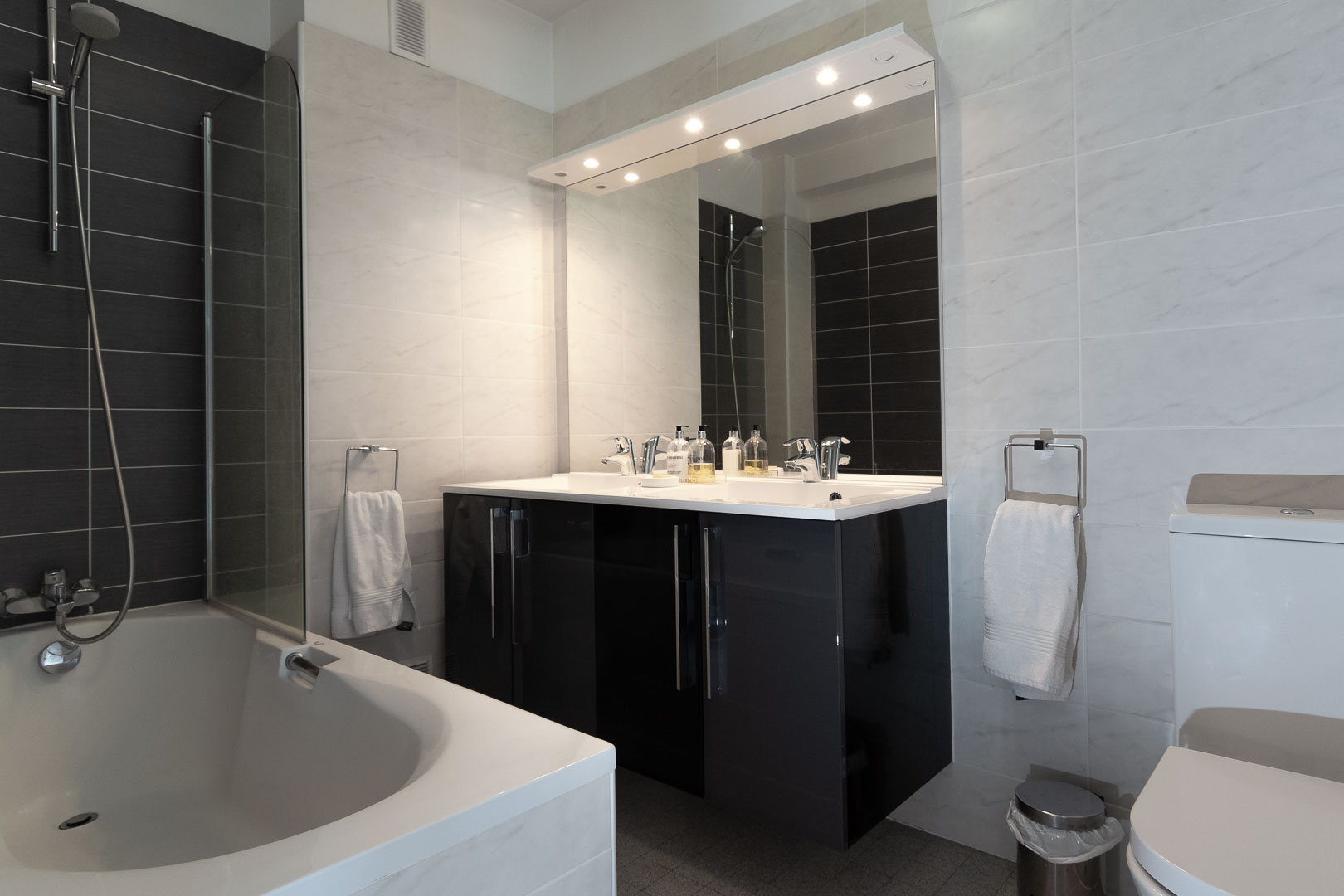 Bathroom with bath and shower