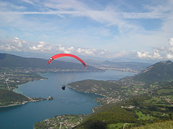 paraglider over lake annecy